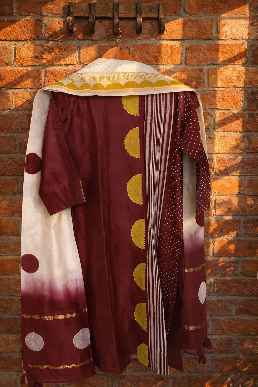 Burgundy Pure Chanderi stitched suit with dupatta displayed on a hanger