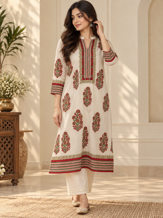 Woman wearing an ivory Crepe silk kurta with red and olive floral motifs