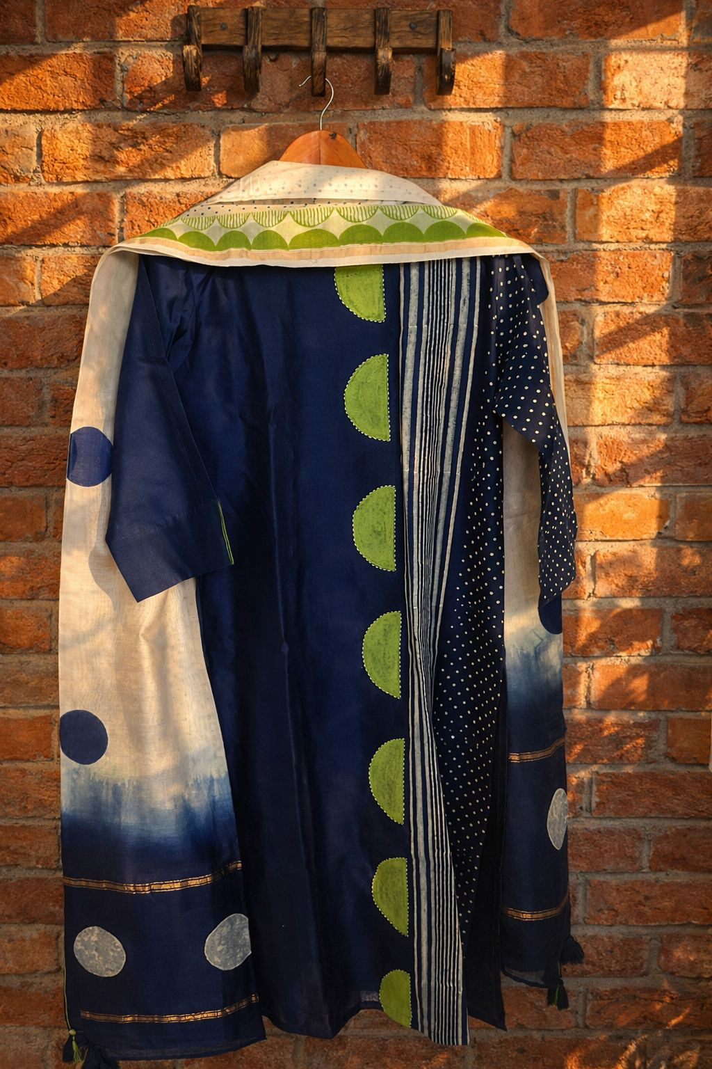 Pure Chanderi stitched suit with dupatta displayed on a hanger