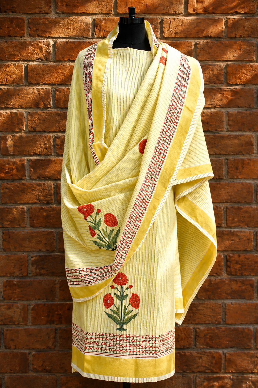Lemon yellow floral hand block printed pure cotton suit with mull dupatta on mannequin - Studio Rang