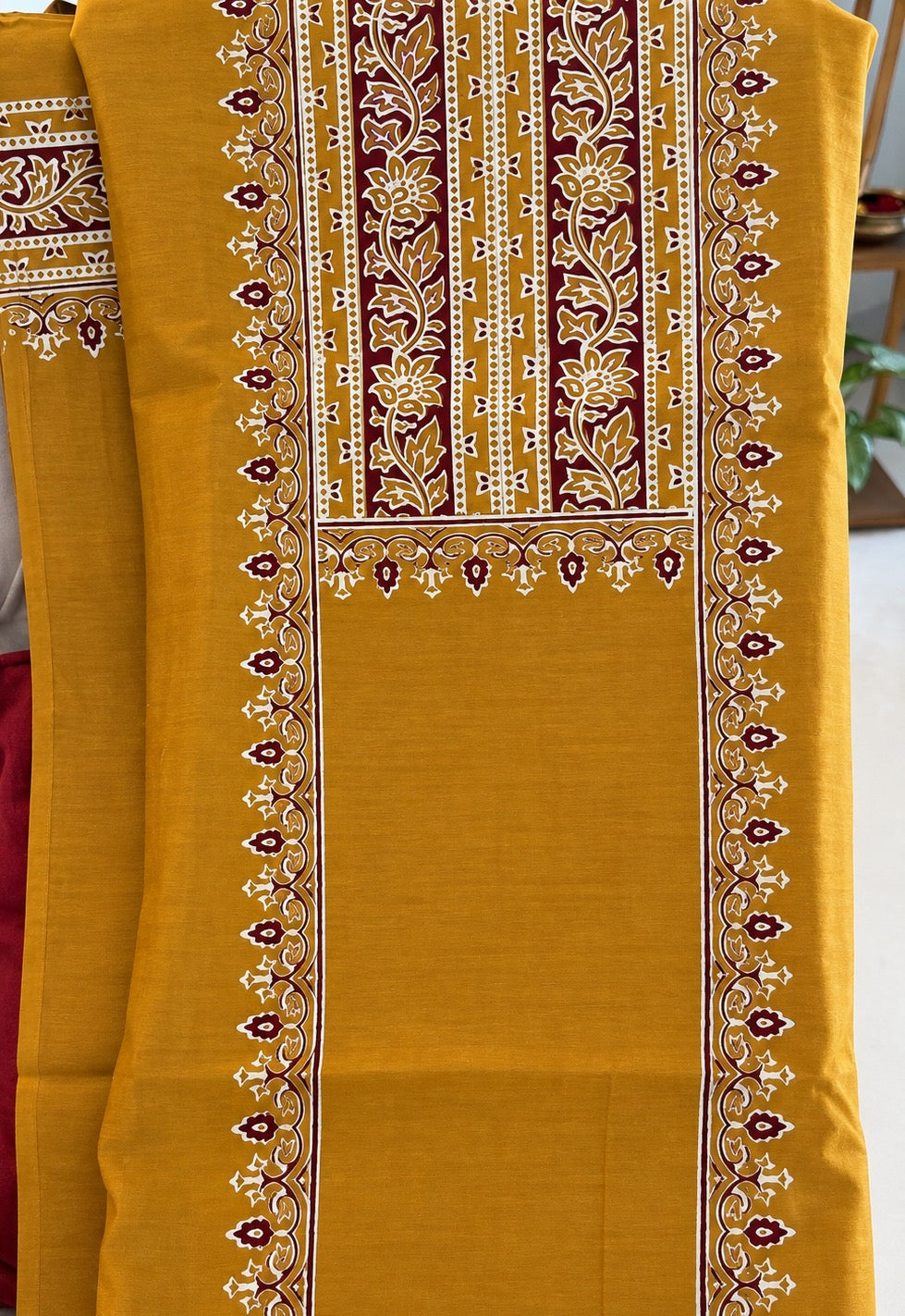 Mustard yellow suit fabric with floral panel